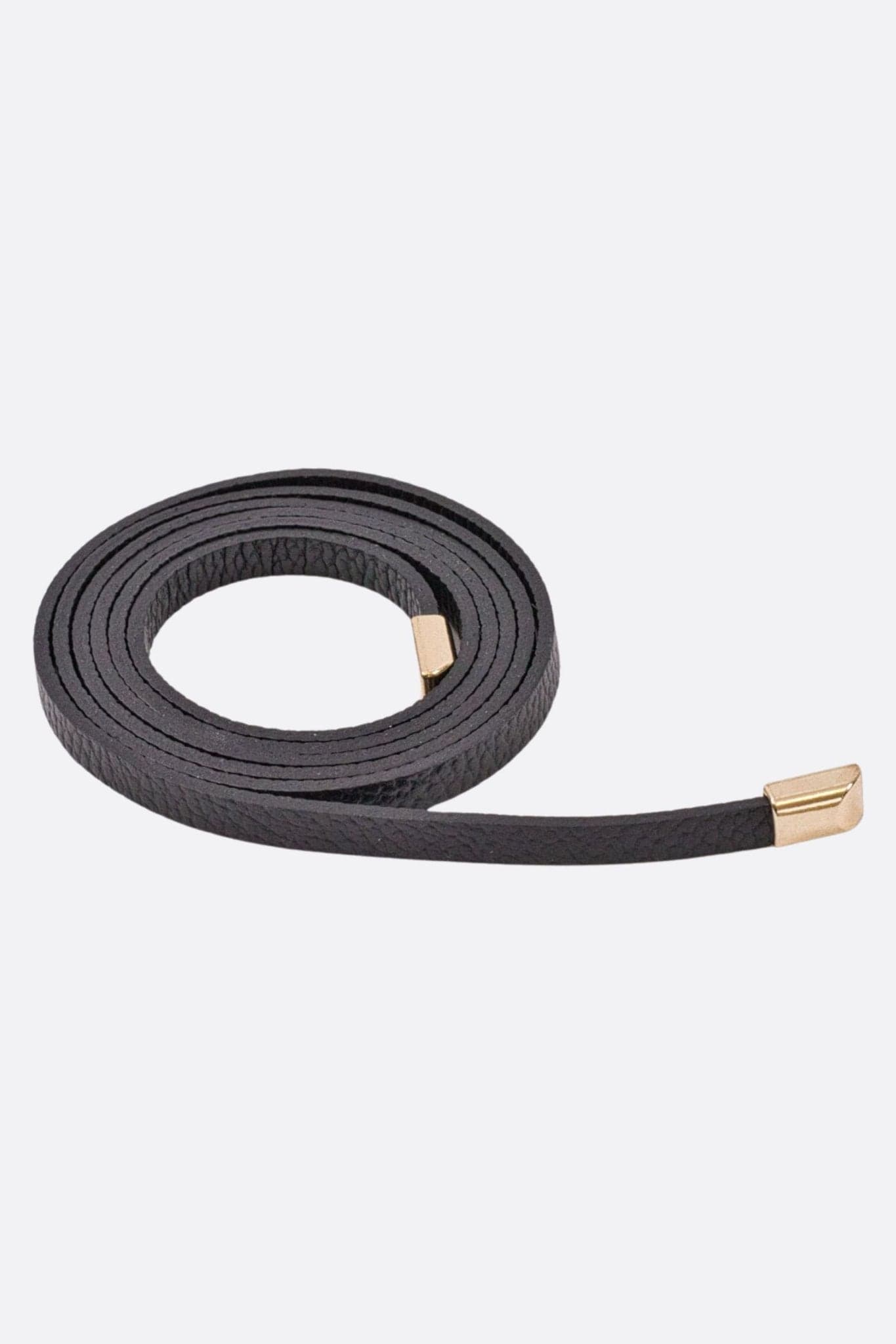 Elegant black calf leather belt with golden tips, perfect for enhancing evening and casual outfits.