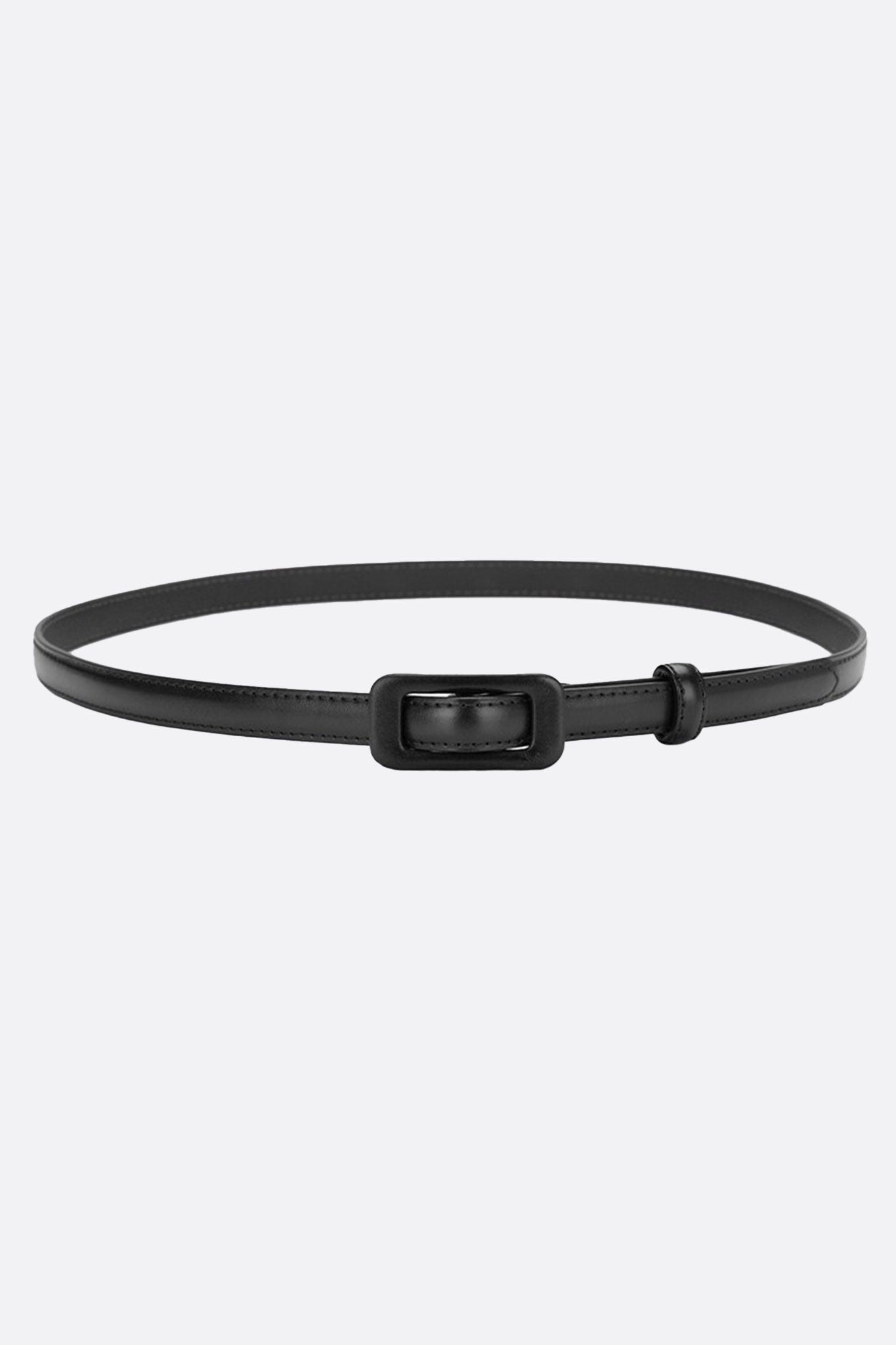 Fine black belt with rectangular buckle, crafted from recycled material, perfect for enhancing an elegant waist.