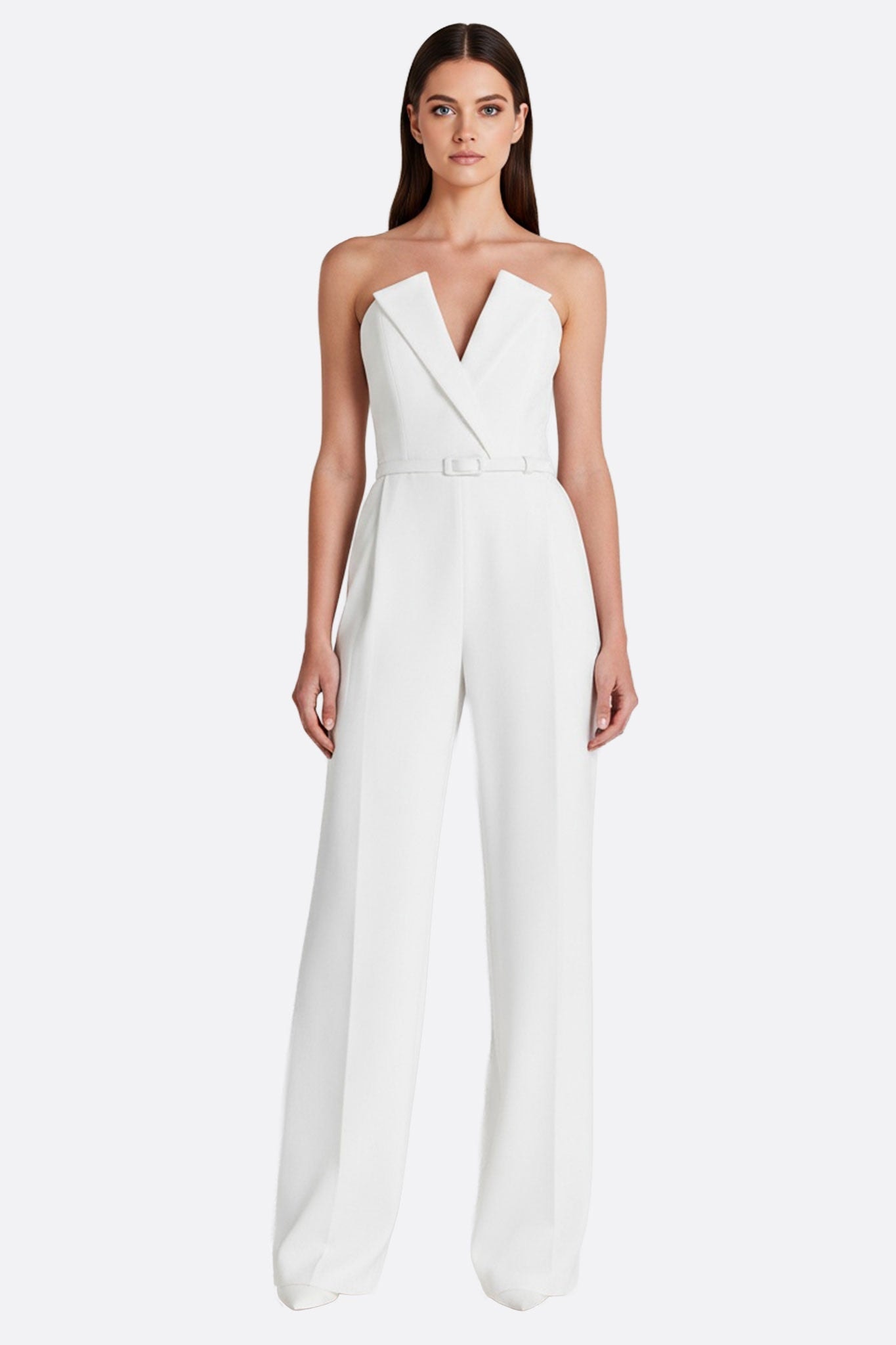 Close-up on the white strapless jumpsuit, highlighting the beaded sleeves, ideal for a chic nuptial ceremony...