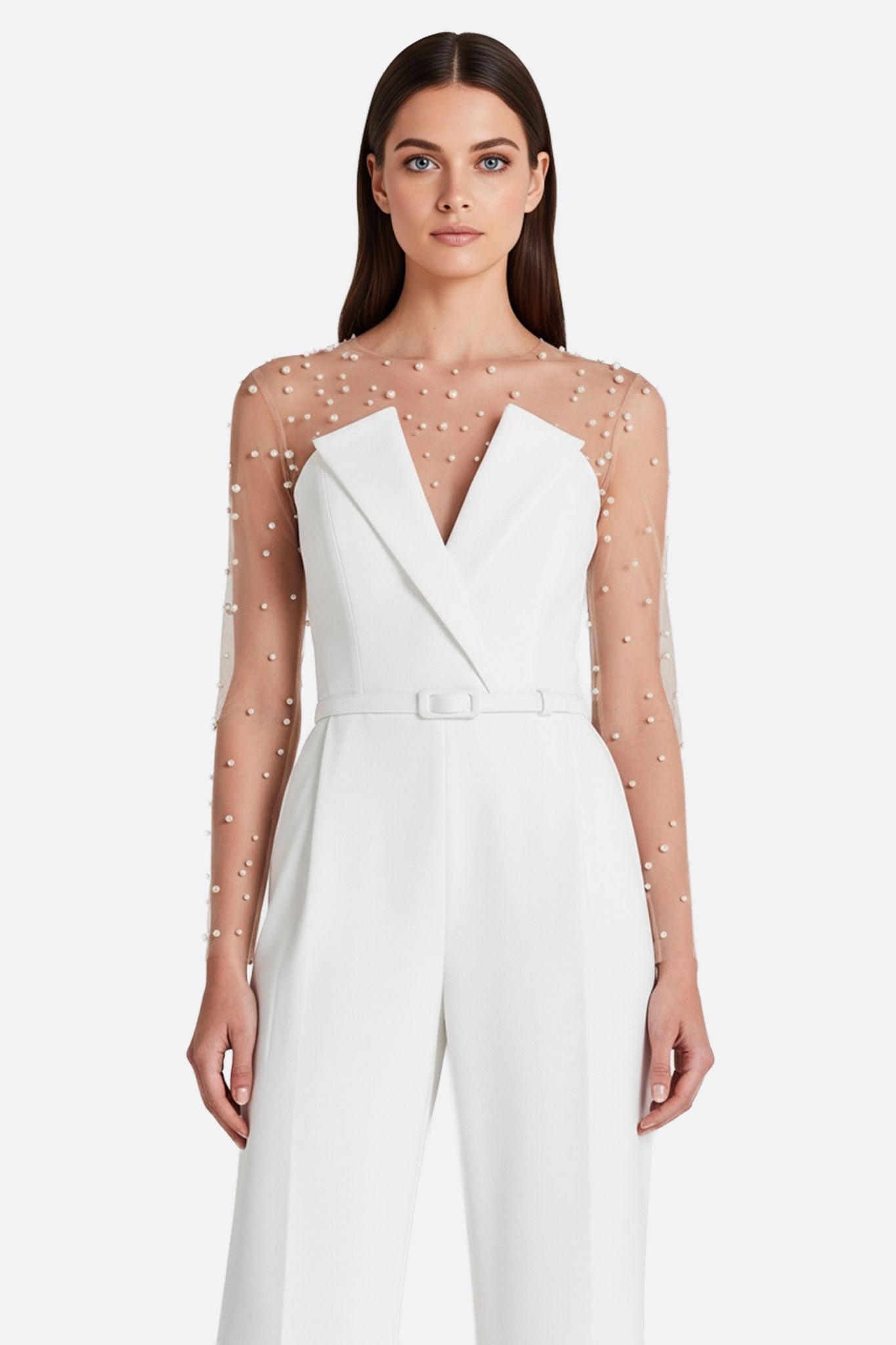 Alternative perspective on the white strapless jumpsuit, emphasizing its sophisticated design for an evening...
