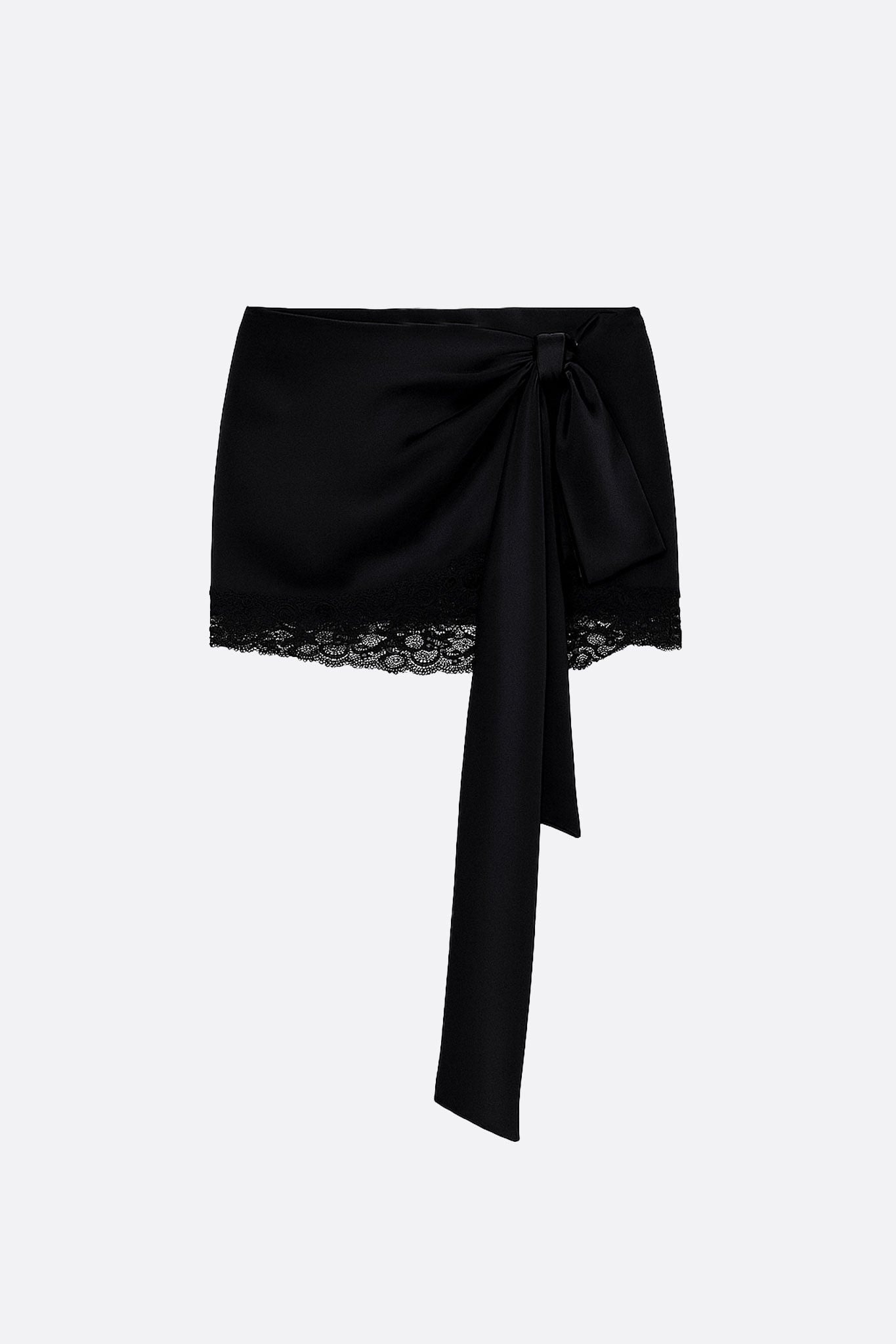 Underneath of the black satin and lace skirt, showcasing the asymmetry and opulent texture for a chic style