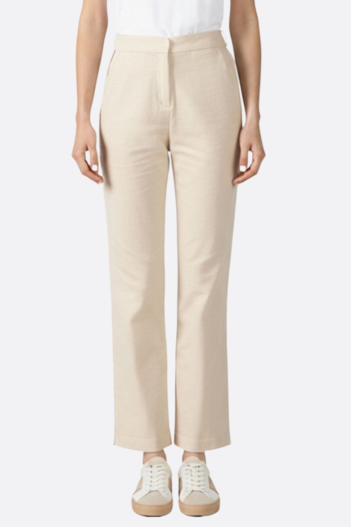 Pantaloni beige a vita alta in tessuto elastico, ideali per un look elegante e versatile da indossare in ogni occasione.