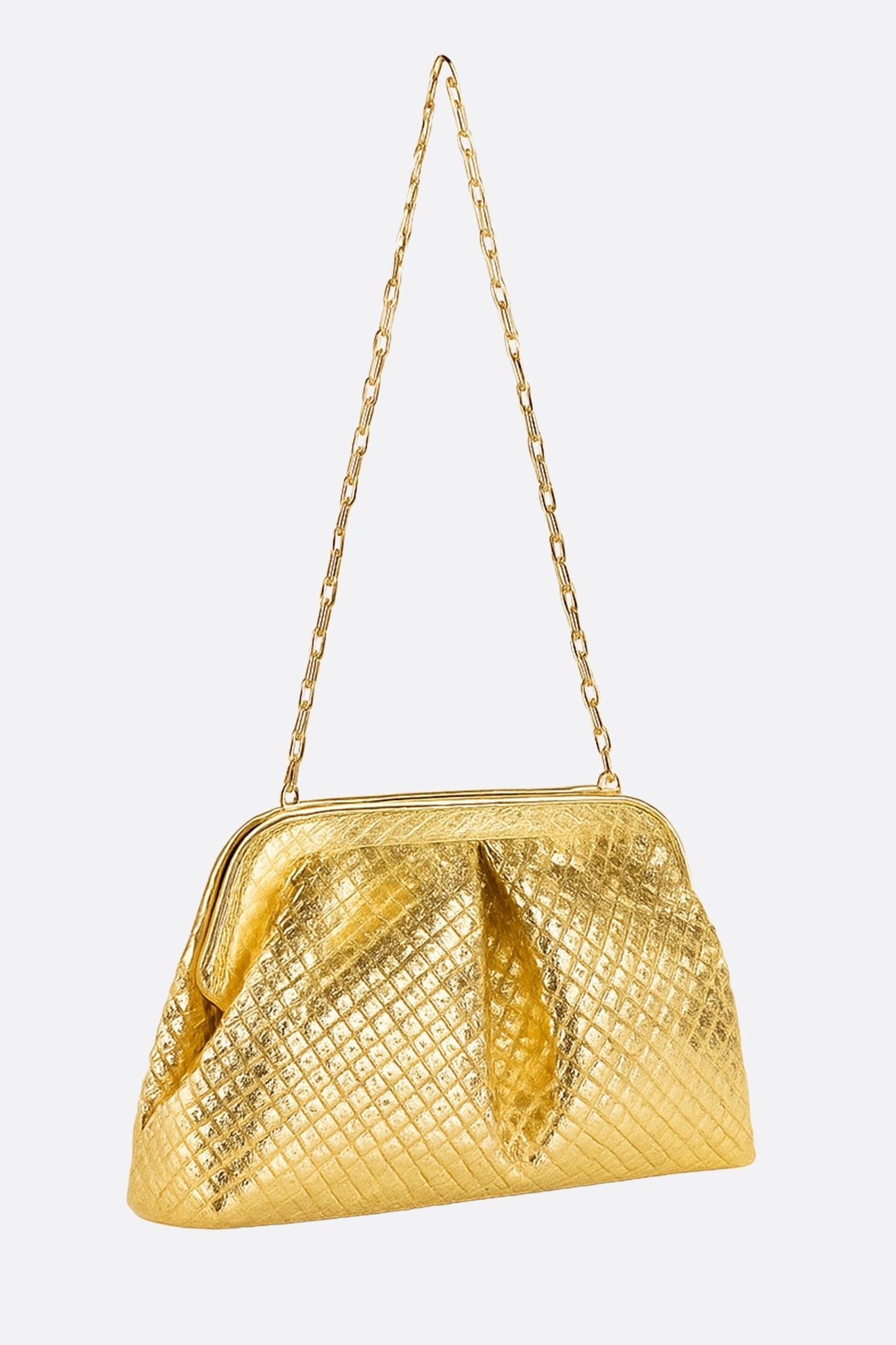 Close-up of the woven texture of a gold PU clutch, a chic accessory for elegant night outs