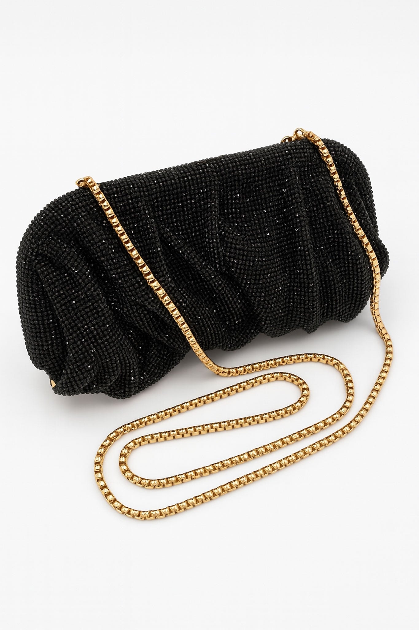 Detail of the black strass clutch with pleating, a chic accessory for elegant and refined evenings.