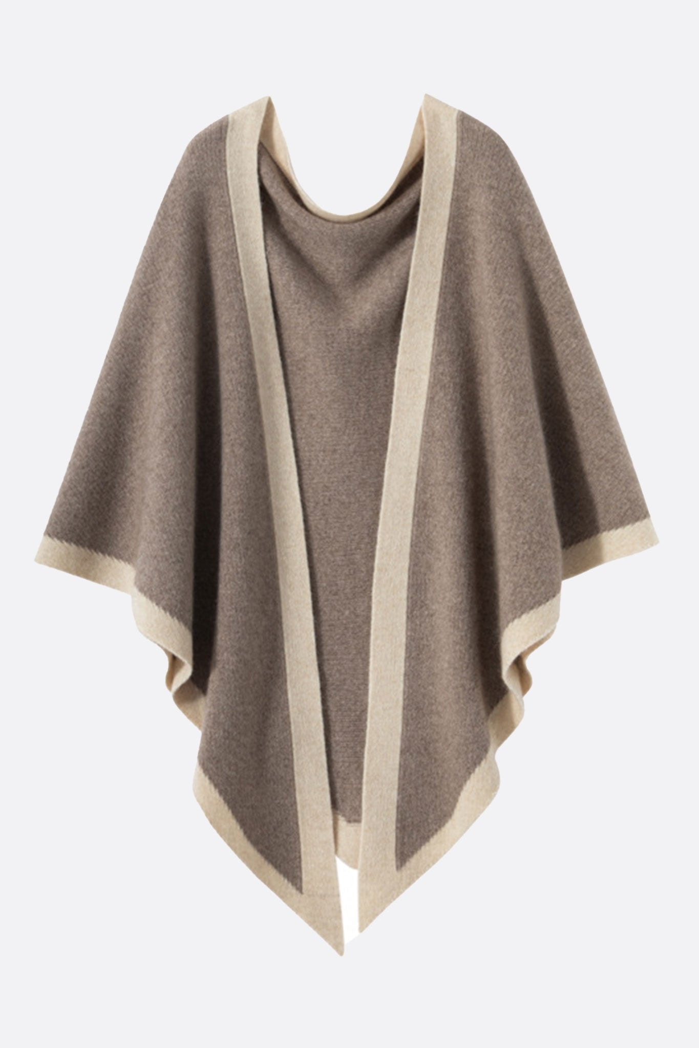 Detail of a taupe cashmere poncho with beige bands, an elegant piece to elevate a chic everyday look.