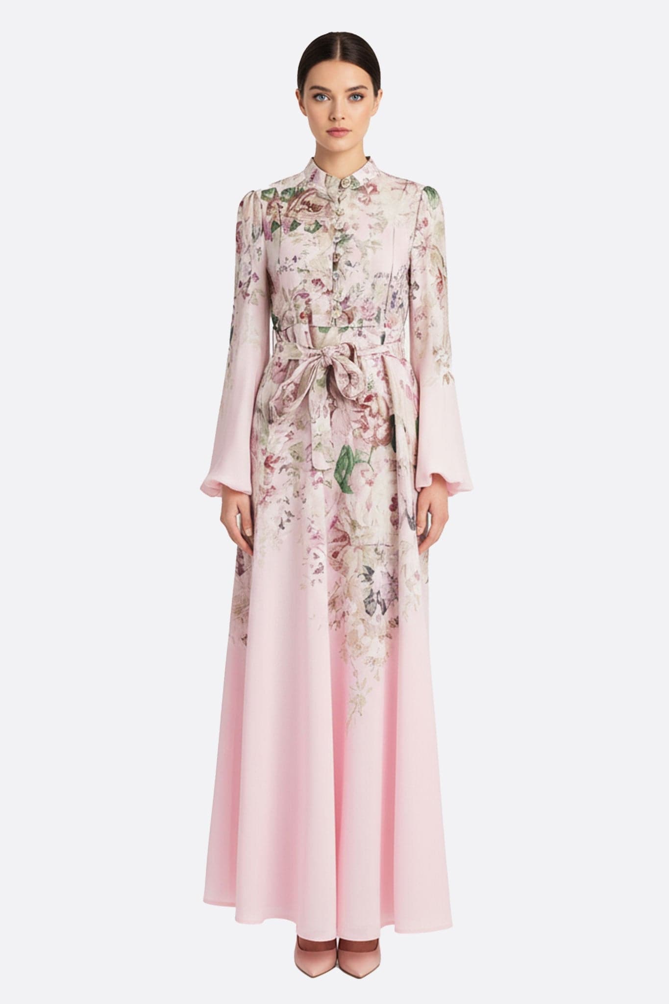 Robe longue rose à imprimé floral, mettant en avant des boutons bijoux, parfaite pour une soirée romantique et élégante.