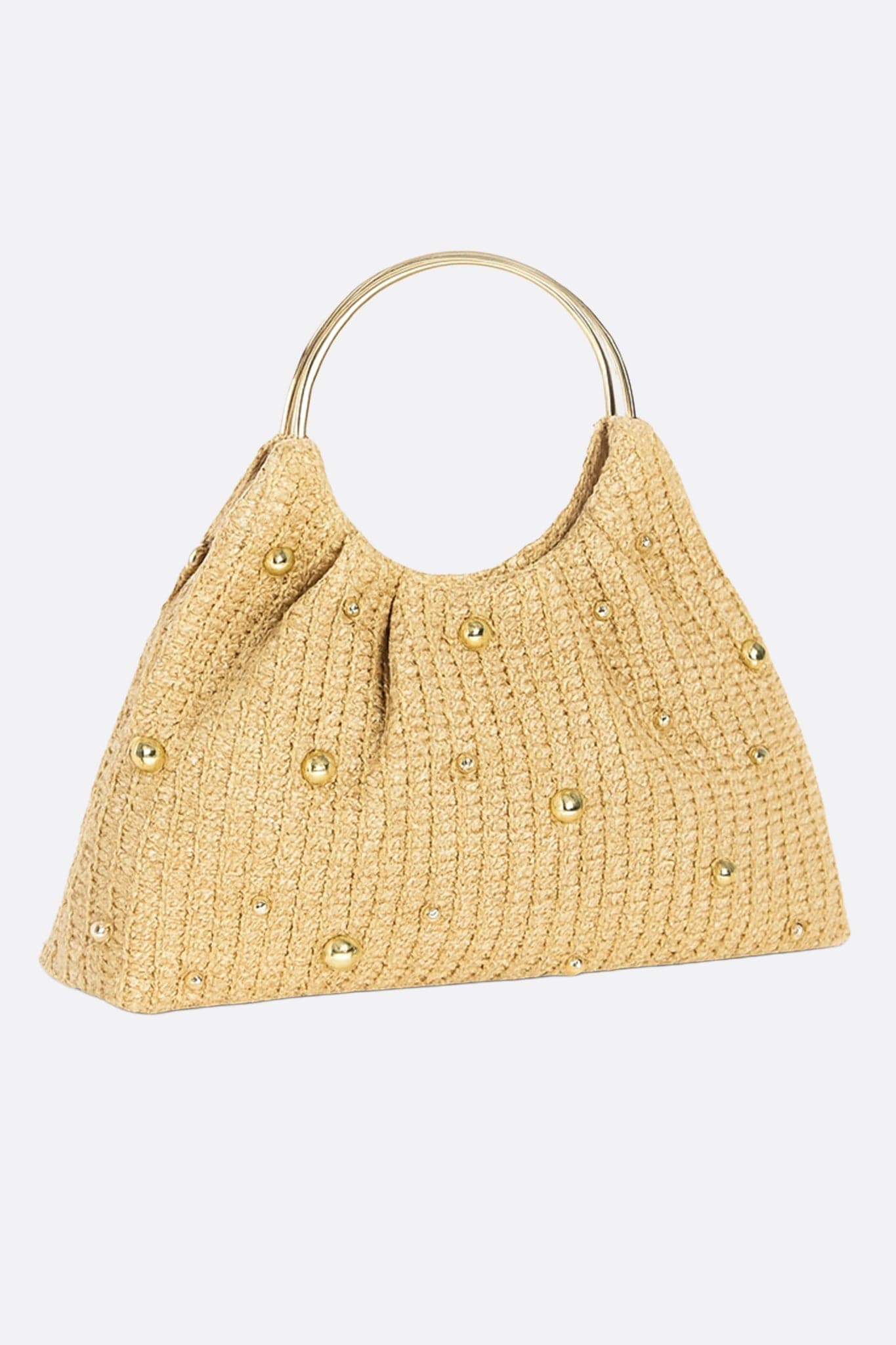 Close-up of the golden raffia tote, refined bead embellishments, ideal for summer getaways or chic events